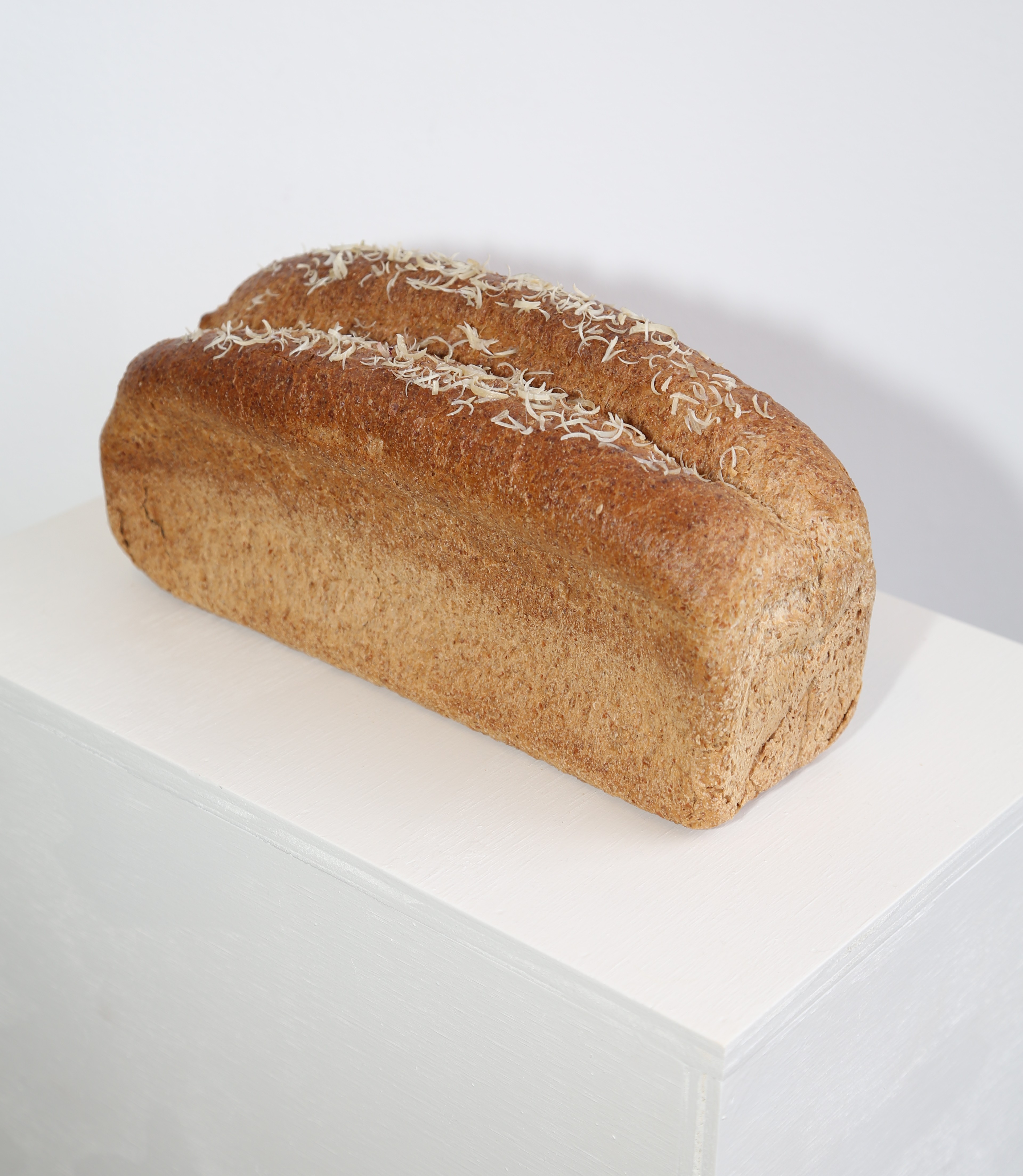 Bread loaf topped with fingernails