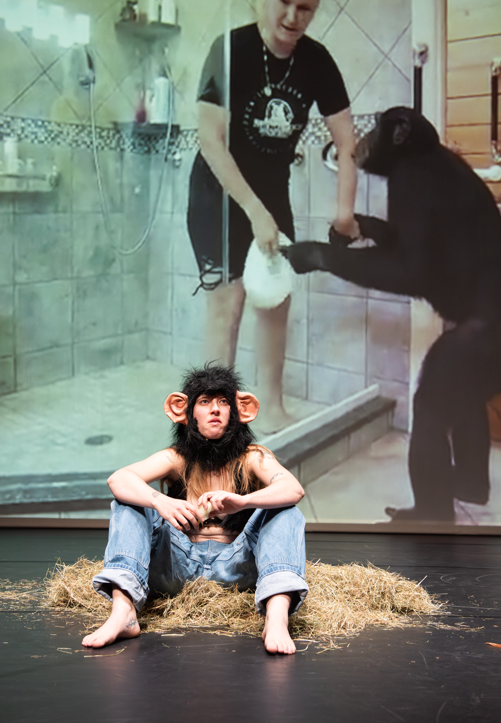 Performance eating an onion in a fur bikini