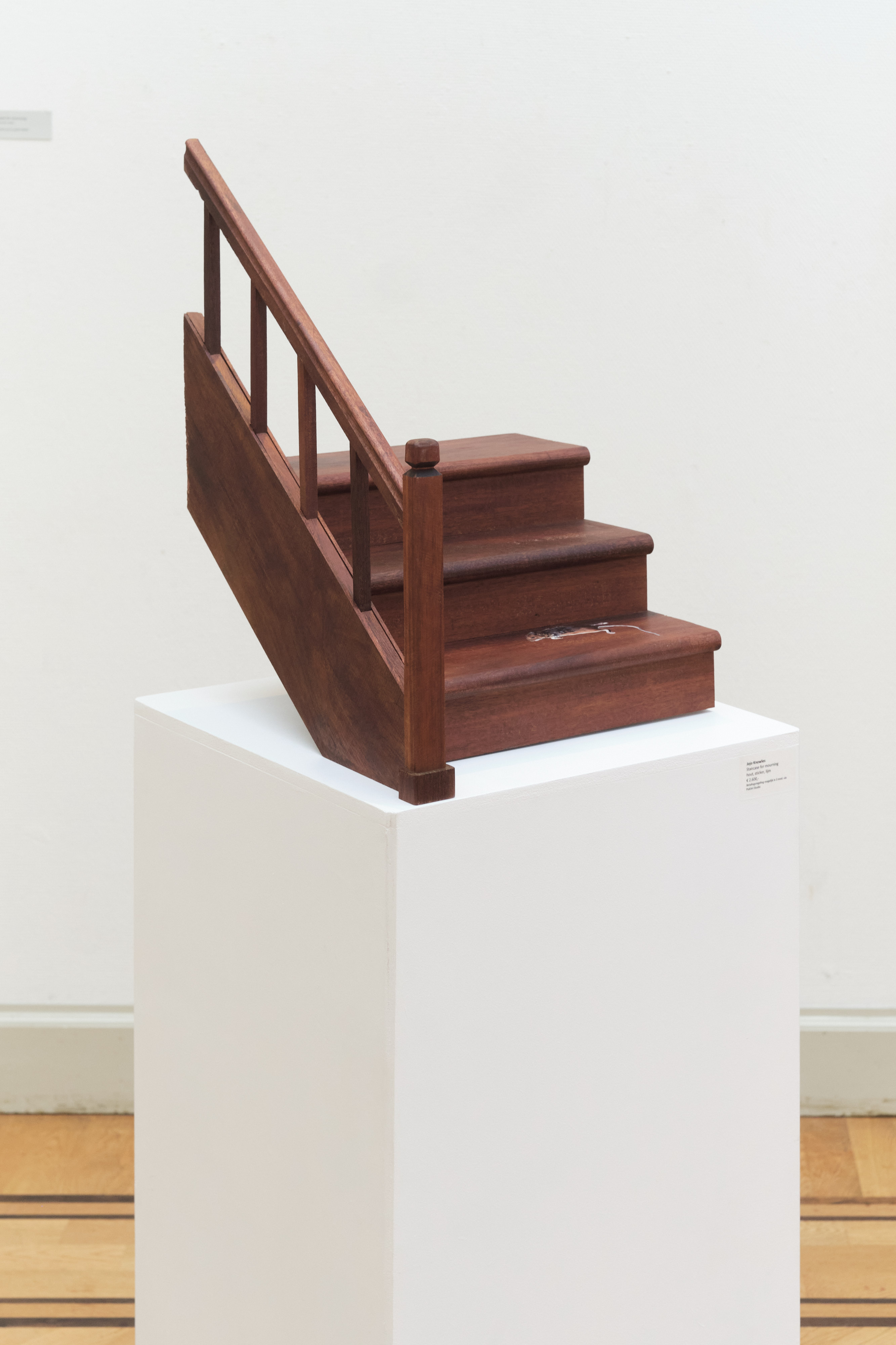 Small staircase with a sticker of a dead mouse